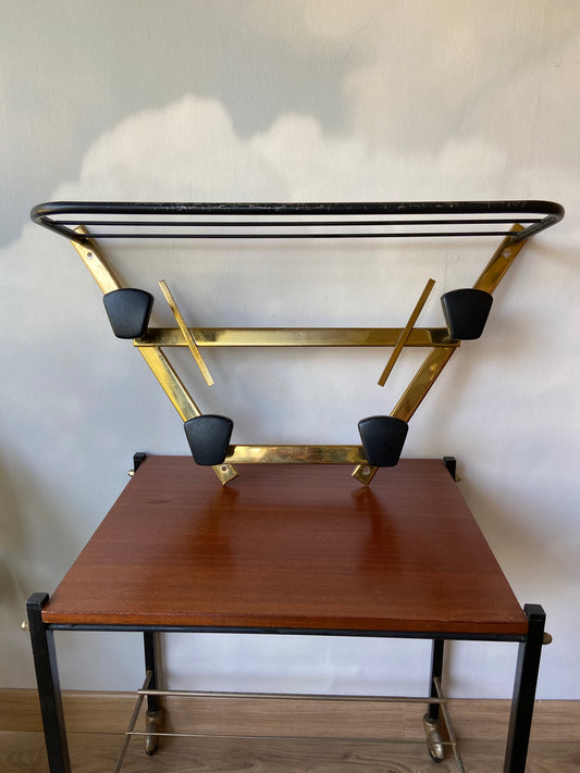 Vintage coat rack with black and gold metal shelf