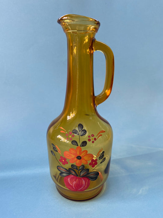 Amber glass carafe with floral pattern handle