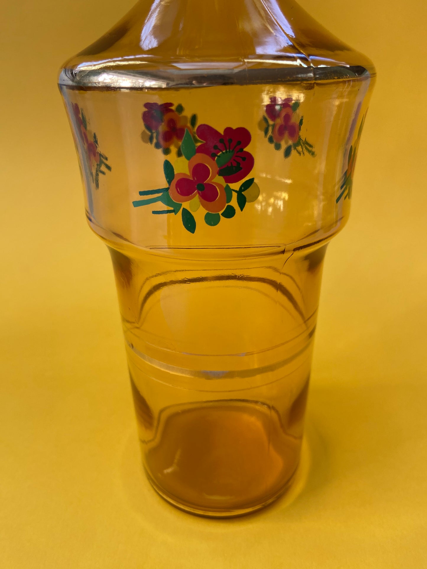 Vintage amber carafe with flower pattern