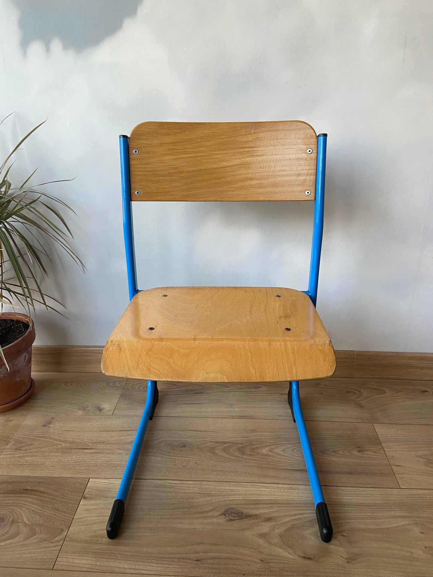 Wooden school chair with blue metal “sled” structure