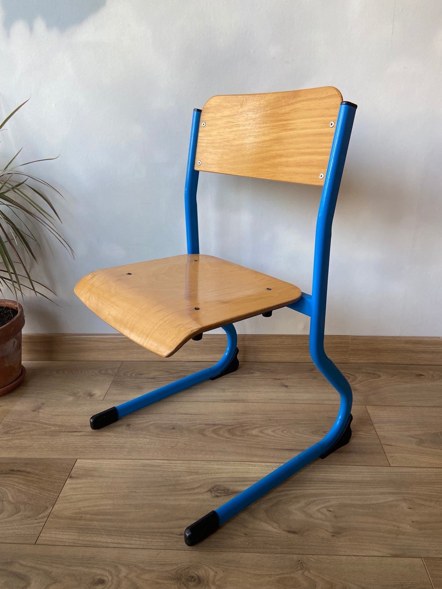 Wooden school chair with blue metal “sled” structure