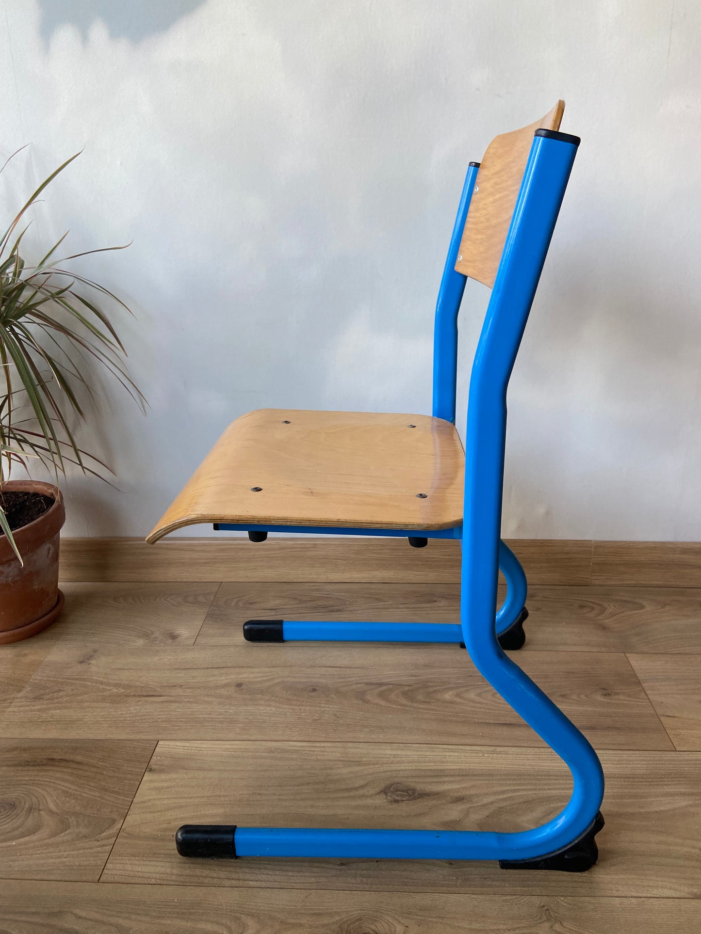 Wooden school chair with blue metal “sled” structure