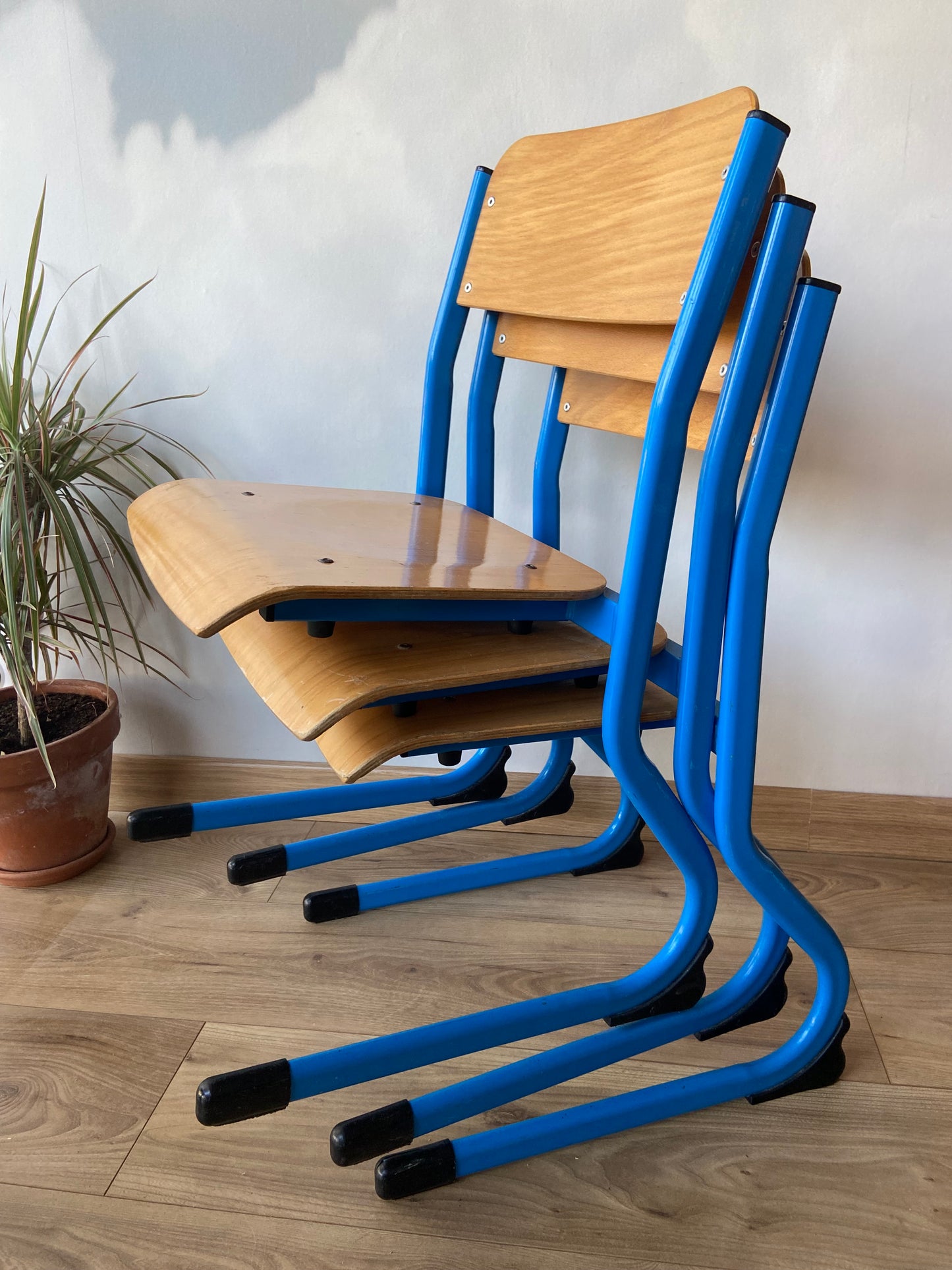 Wooden school chair with blue metal “sled” structure