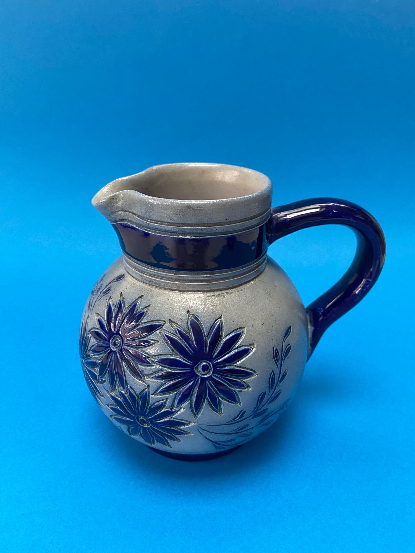 Duo of ALSACE stoneware pitchers with floral motif signed