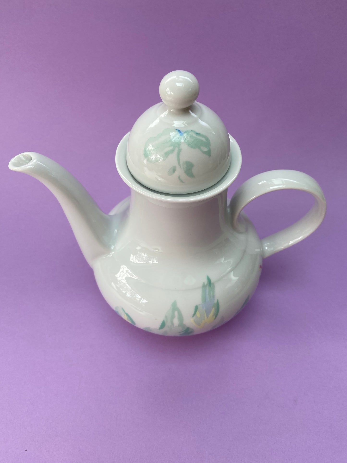 Antique German porcelain teapot with pastel floral decoration