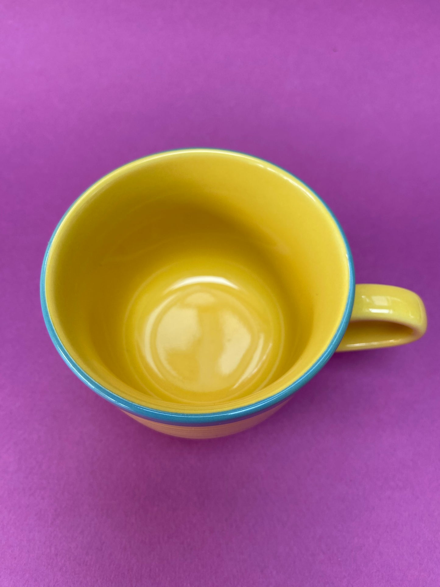 Yellow cup with blue border