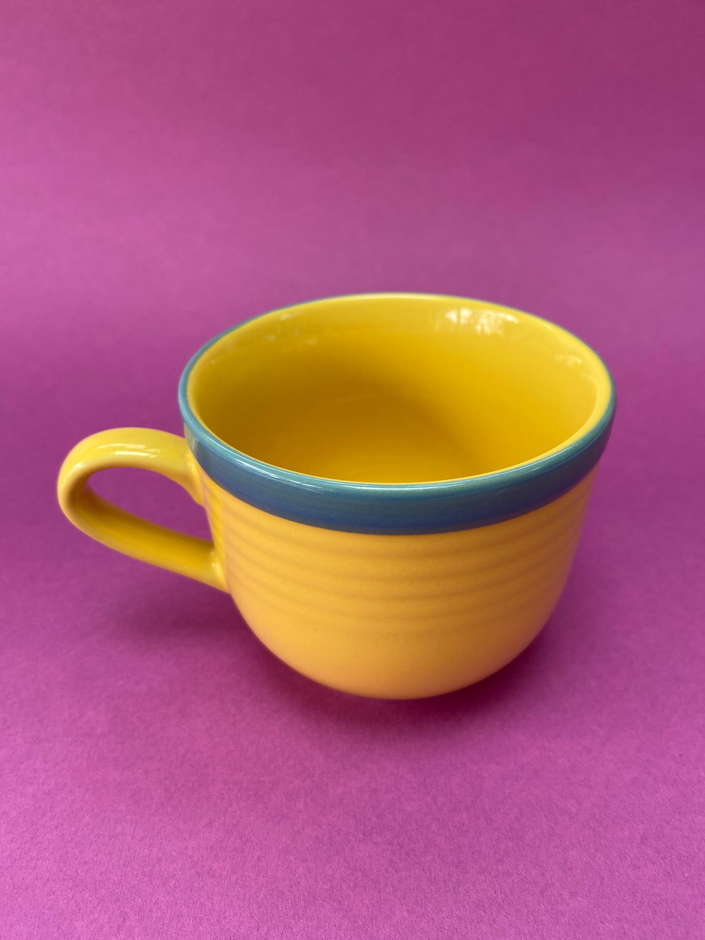 Yellow cup with blue border