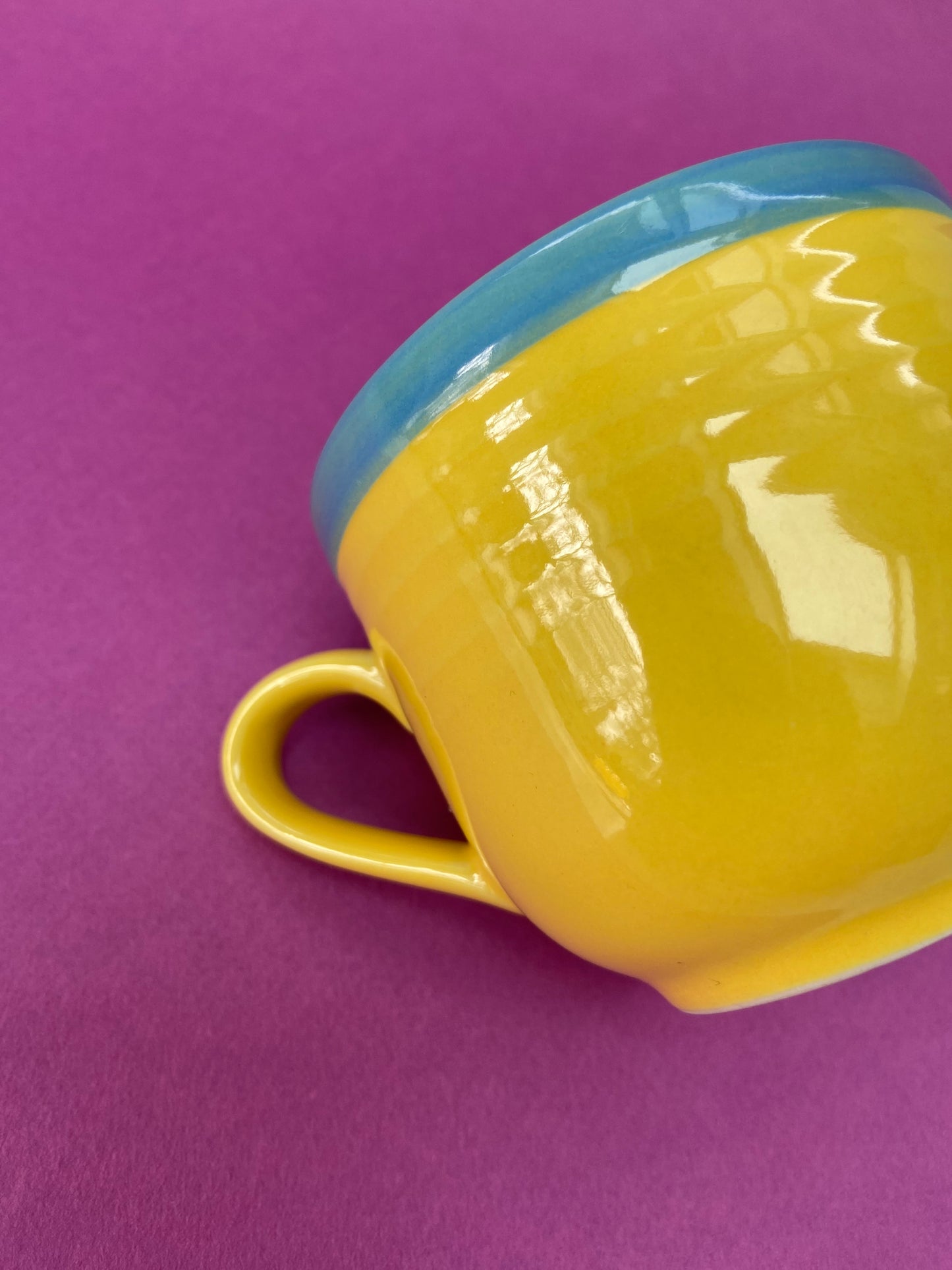 Yellow cup with blue border