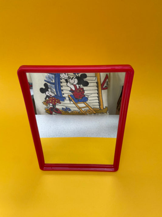 Small red plastic mirror