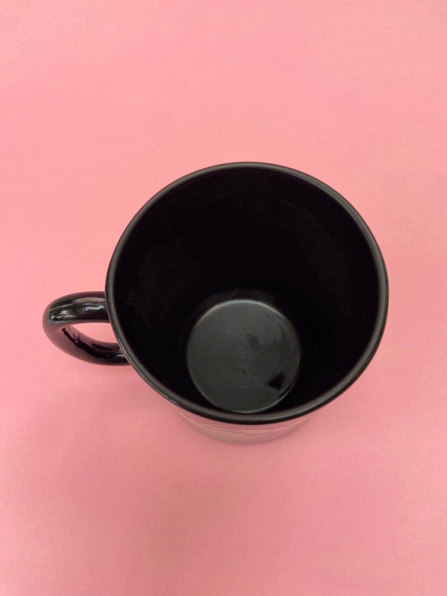 Black mug with pastel plant decor