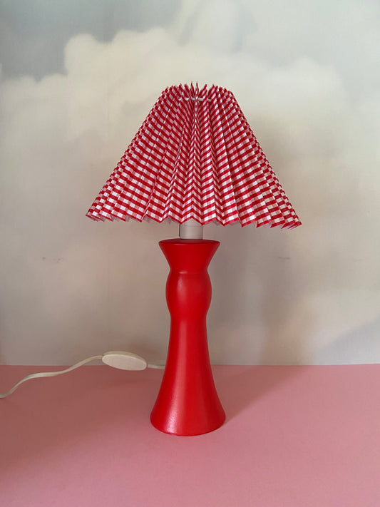 Red ceramic base lamp with gingham pleated lampshade