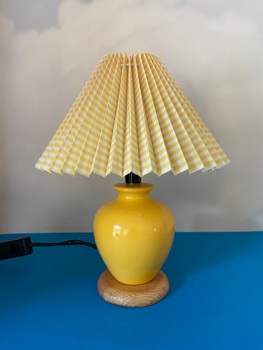 YELLOW ceramic base lamp on wood with pleated gingham lampshade