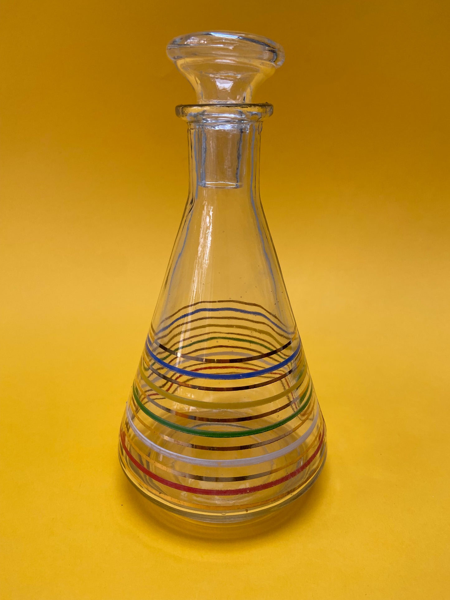 Glass carafe with colored lines