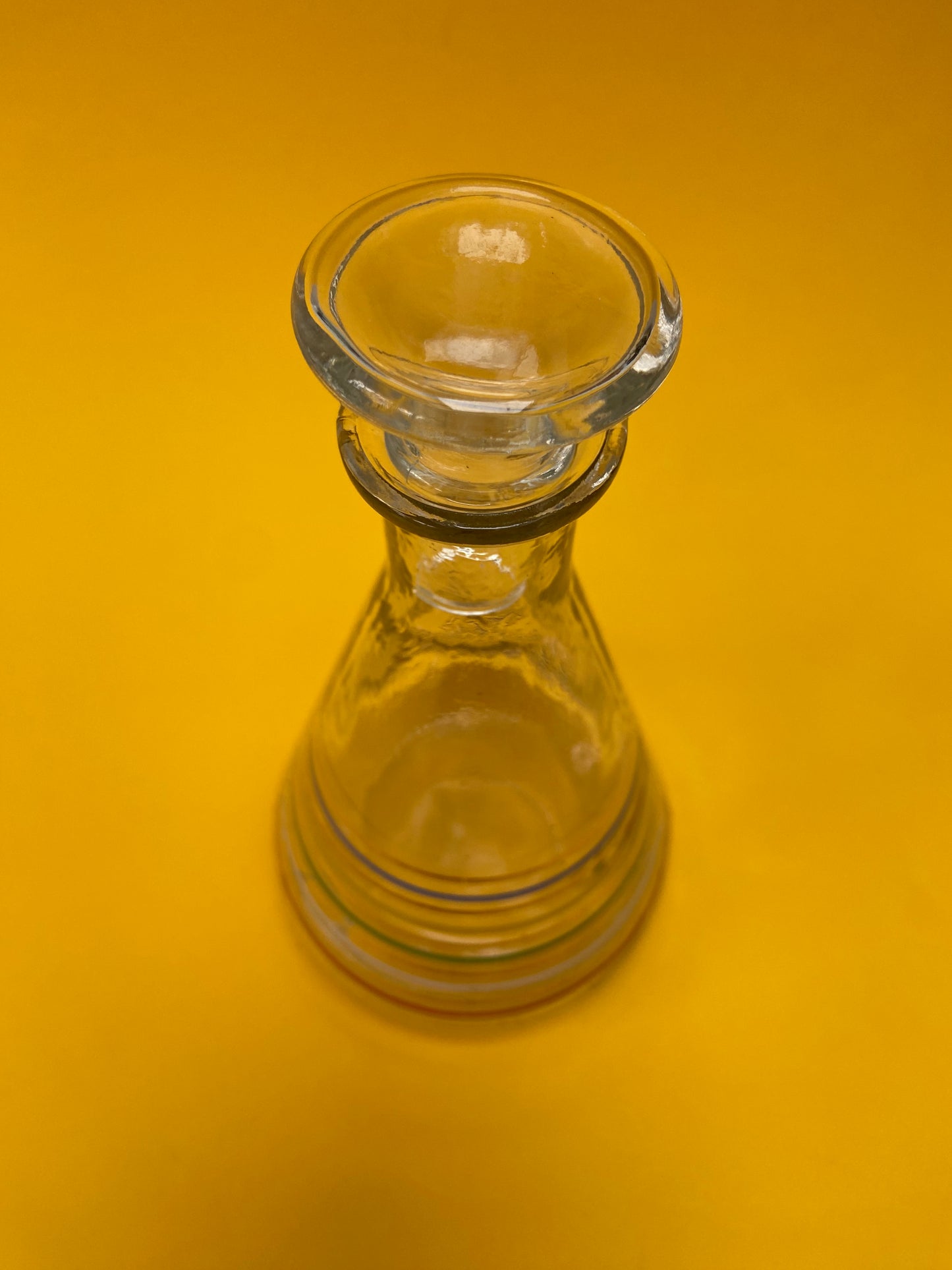 Glass carafe with colored lines