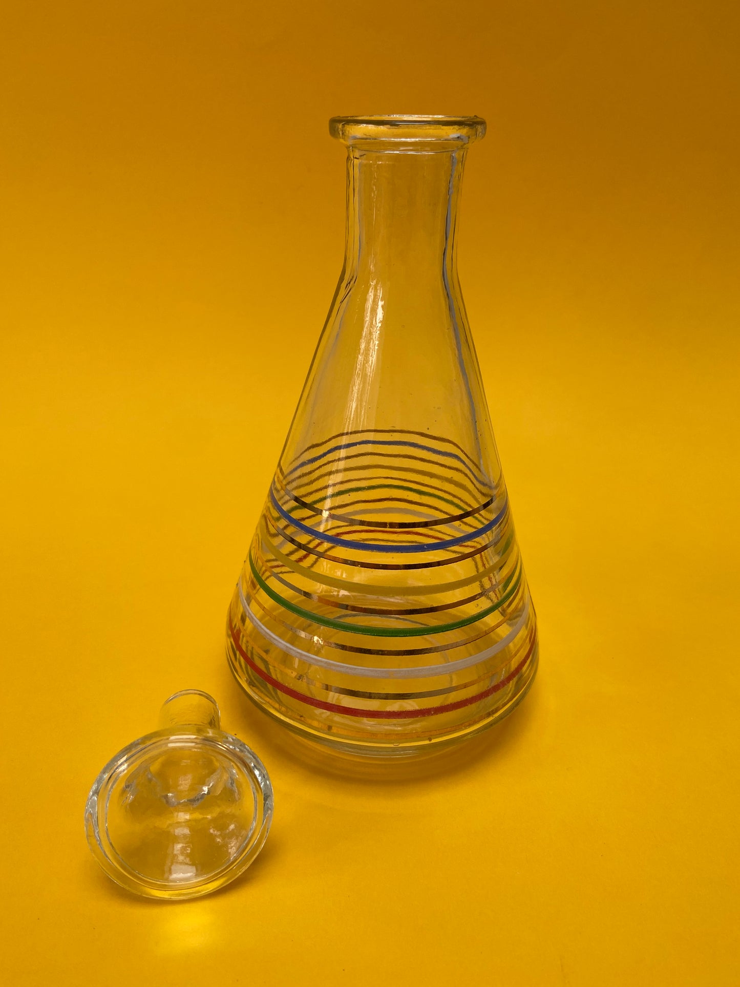 Glass carafe with colored lines