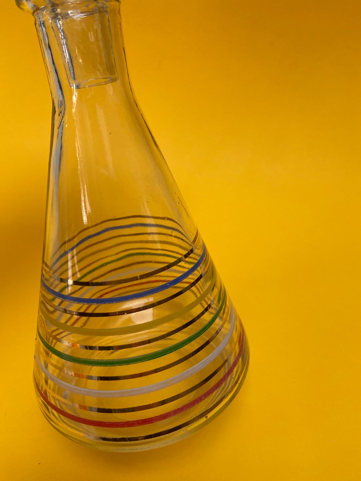 Glass carafe with colored lines