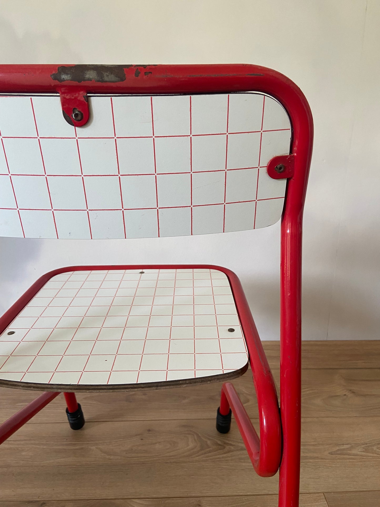 Vintage school chair with grid decor and colored metal structure