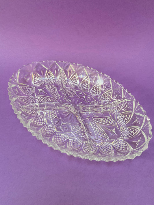 Oval chiseled glass serving dish with 4 compartments.